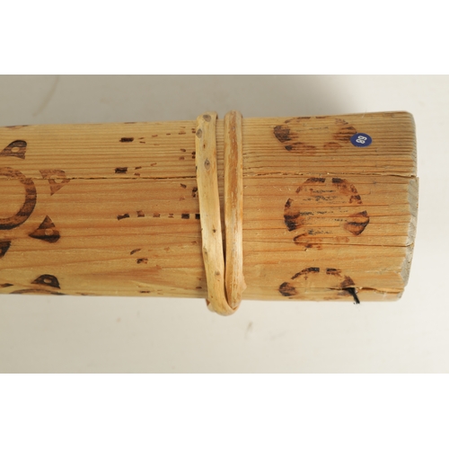 138 - A BAMBOO TAPERING WOOD TRUMPET with scorched ringed decoration.(154cm overall)