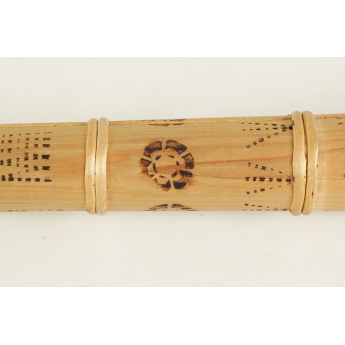 138 - A BAMBOO TAPERING WOOD TRUMPET with scorched ringed decoration.(154cm overall)