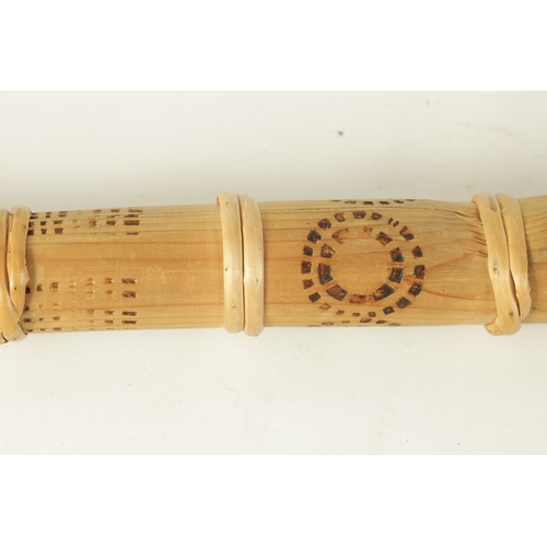 138 - A BAMBOO TAPERING WOOD TRUMPET with scorched ringed decoration.(154cm overall)