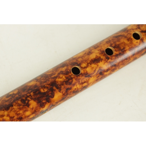 144 - A SIMULATED TORTOISHELL BAMBOO RECORDER with 12 finger holes.(42cm long)