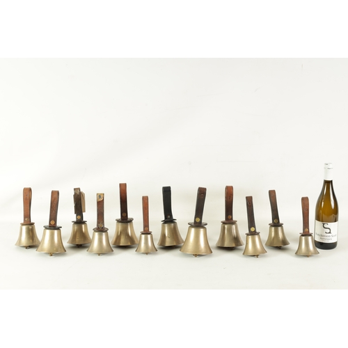 147 - A SET OF 12 HAND BELLS SIGNED WARNER, LONDON with leather strap handles having star punch decoration... 