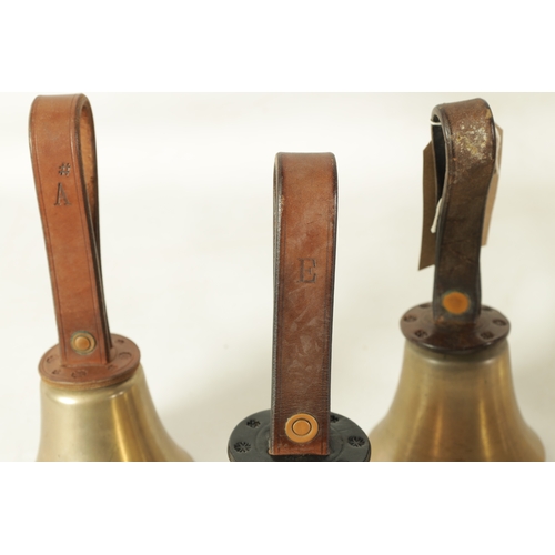 147 - A SET OF 12 HAND BELLS SIGNED WARNER, LONDON with leather strap handles having star punch decoration... 