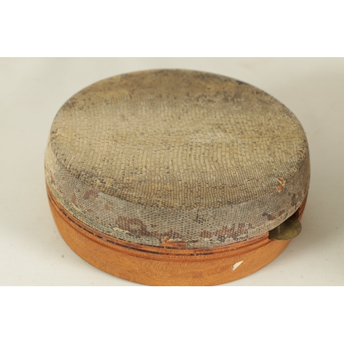 148 - A VINTAGE SNAKE SKIN TAMBOURINE TOGETHER WITH A BARK DRUM(27cm & 17cm diameter)