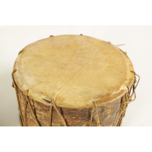 148 - A VINTAGE SNAKE SKIN TAMBOURINE TOGETHER WITH A BARK DRUM(27cm & 17cm diameter)