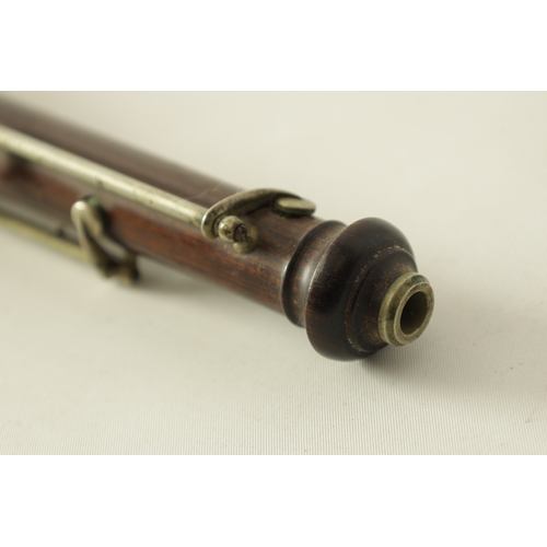 153 - A LATE 19TH CENTURY SLENDER ROSEWOOD OBOE with metal banded detail to the body and all fittings.(55c... 