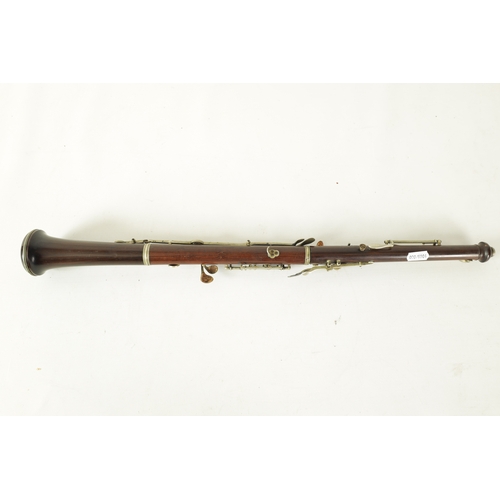 153 - A LATE 19TH CENTURY SLENDER ROSEWOOD OBOE with metal banded detail to the body and all fittings.(55c... 