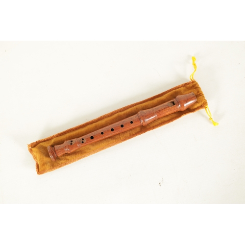 19 - A TWO SECTION KUNG SOPRANINO RECORDER turned in olive wood with impressed makers mark - in cord case... 