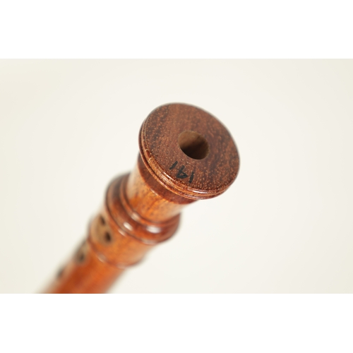 19 - A TWO SECTION KUNG SOPRANINO RECORDER turned in olive wood with impressed makers mark - in cord case... 