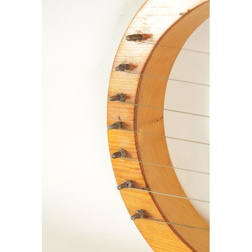 27 - A LYRE HARP fitted seven strings and pierced sound frets(67.5cm overall)