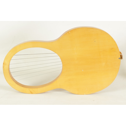 27 - A LYRE HARP fitted seven strings and pierced sound frets(67.5cm overall)