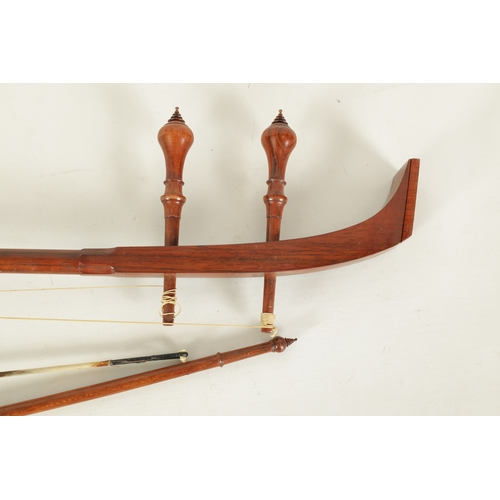 37 - A SAW DUANG TWO STRING THAI FIDDLE WITH BOW the turned neck with quadrant end and baluster tuning pe... 