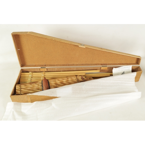 43 - A COLLECTION OF FOUR VARIOUS SIZE BAMBOO PANPIPES in wooden case (4)(Largest is 83.5cm long)... 