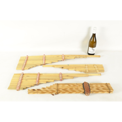 43 - A COLLECTION OF FOUR VARIOUS SIZE BAMBOO PANPIPES in wooden case (4)(Largest is 83.5cm long)... 