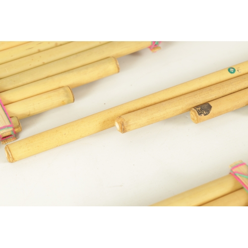 43 - A COLLECTION OF FOUR VARIOUS SIZE BAMBOO PANPIPES in wooden case (4)(Largest is 83.5cm long)... 