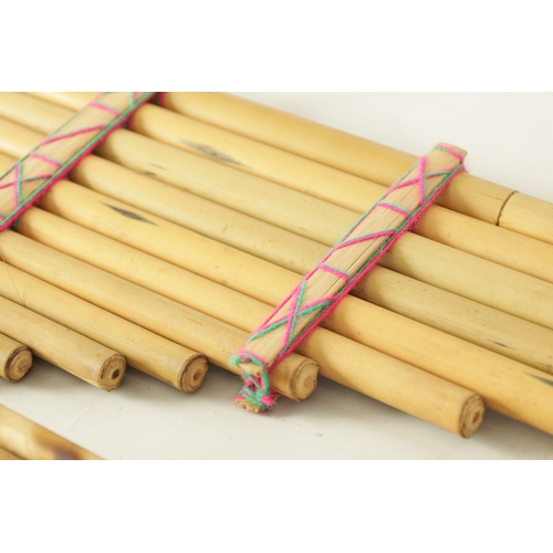 43 - A COLLECTION OF FOUR VARIOUS SIZE BAMBOO PANPIPES in wooden case (4)(Largest is 83.5cm long)... 