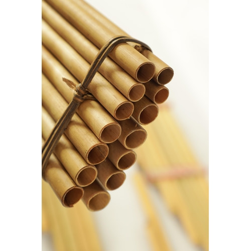 43 - A COLLECTION OF FOUR VARIOUS SIZE BAMBOO PANPIPES in wooden case (4)(Largest is 83.5cm long)... 