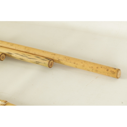 43 - A COLLECTION OF FOUR VARIOUS SIZE BAMBOO PANPIPES in wooden case (4)(Largest is 83.5cm long)... 