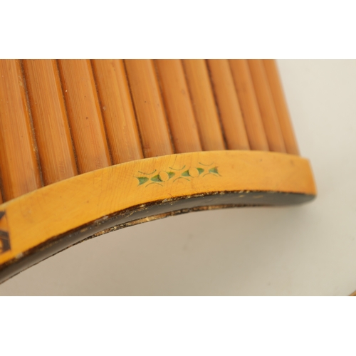 46 - TWO PROFESSIONAL PANPIPES the smaller with carved decoration to the bamboo pipes, the larger having ... 