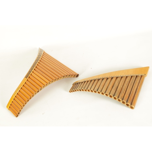 46 - TWO PROFESSIONAL PANPIPES the smaller with carved decoration to the bamboo pipes, the larger having ... 