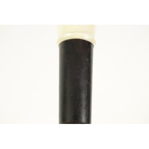 50 - A GOOD QUALITY HANS COOLSMA ALTO RECORDER fitted an ivory mouthpiece and turning on a rosewood body,... 