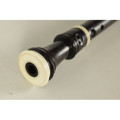 50 - A GOOD QUALITY HANS COOLSMA ALTO RECORDER fitted an ivory mouthpiece and turning on a rosewood body,... 