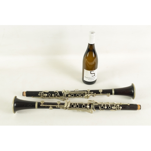 54 - TWO EARLY 20TH CENTURY BUFFET CLARINETS turned in ebony with nickel buttons and impressed makers mar... 