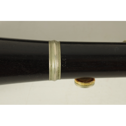 54 - TWO EARLY 20TH CENTURY BUFFET CLARINETS turned in ebony with nickel buttons and impressed makers mar... 