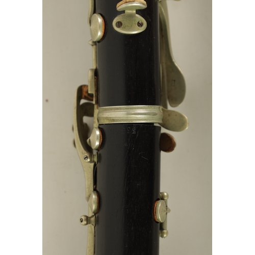 54 - TWO EARLY 20TH CENTURY BUFFET CLARINETS turned in ebony with nickel buttons and impressed makers mar... 