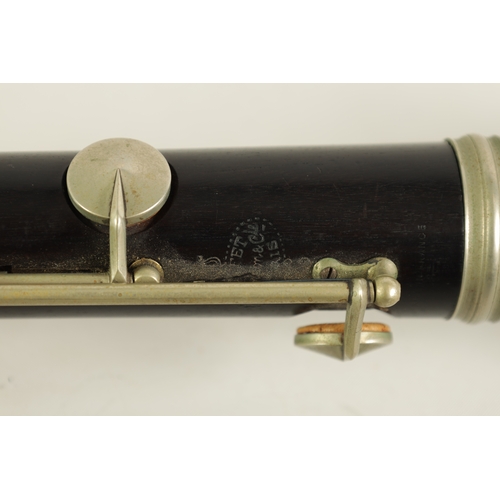 54 - TWO EARLY 20TH CENTURY BUFFET CLARINETS turned in ebony with nickel buttons and impressed makers mar... 