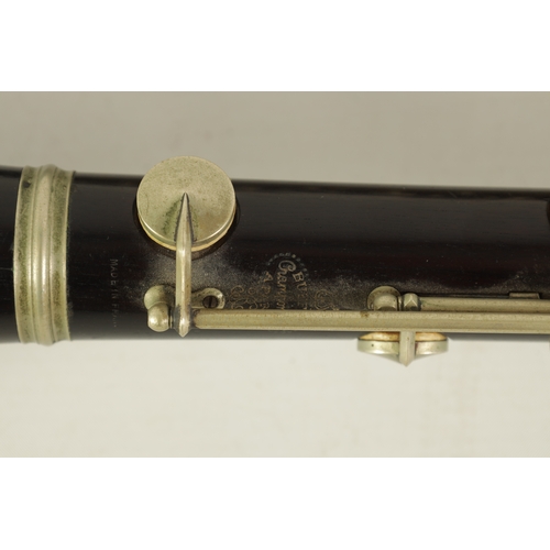 54 - TWO EARLY 20TH CENTURY BUFFET CLARINETS turned in ebony with nickel buttons and impressed makers mar... 