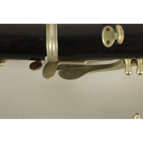 54 - TWO EARLY 20TH CENTURY BUFFET CLARINETS turned in ebony with nickel buttons and impressed makers mar... 