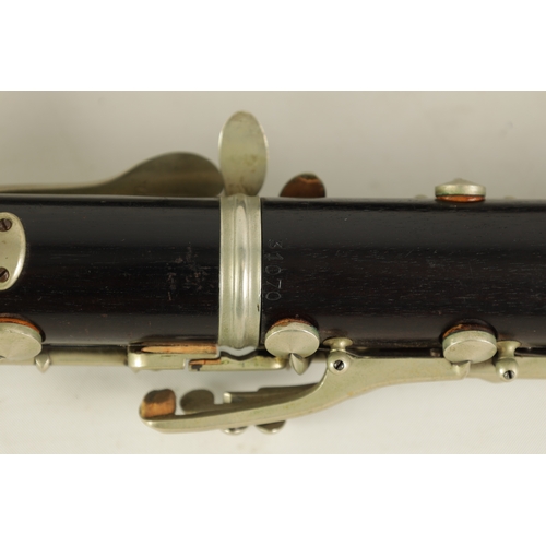 54 - TWO EARLY 20TH CENTURY BUFFET CLARINETS turned in ebony with nickel buttons and impressed makers mar... 