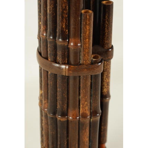 60 - A LATE 19TH CENTURY CHINESE SHENG with brass bowl and mouth piece fitted graduated bamboo pipes.(49.... 