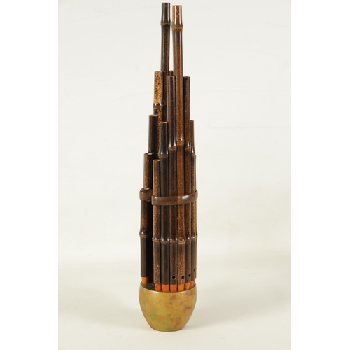 60 - A LATE 19TH CENTURY CHINESE SHENG with brass bowl and mouth piece fitted graduated bamboo pipes.(49.... 