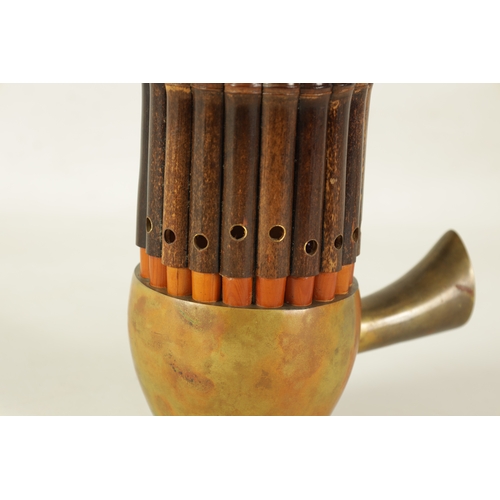 60 - A LATE 19TH CENTURY CHINESE SHENG with brass bowl and mouth piece fitted graduated bamboo pipes.(49.... 