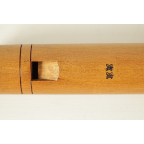 73 - A JOHN COUSEN TENOR RECORDER turned in maple with impressed makers marks(61.9cm long)