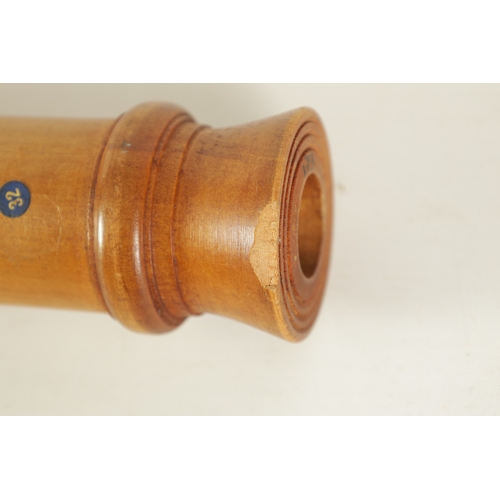 73 - A JOHN COUSEN TENOR RECORDER turned in maple with impressed makers marks(61.9cm long)