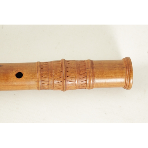 76 - A CARL HANSON FLUTE finely turned in maple with dogtooth carved decoration and impressed makers mark... 