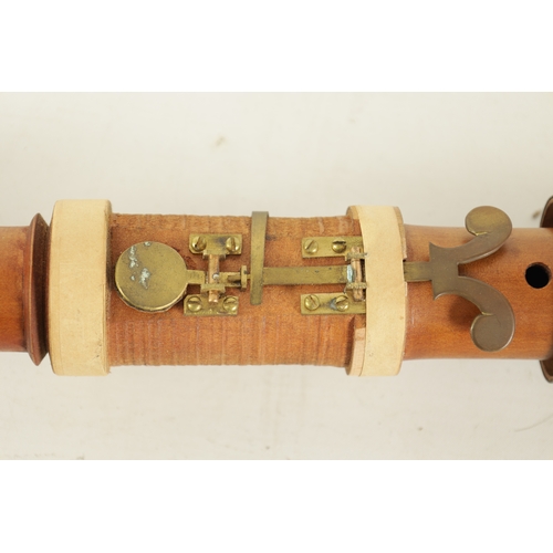 77 - AN EARLY BASS RECORDER BY JOHN COUSEN turned in maple with brass collars and pierced barrel shaped c... 