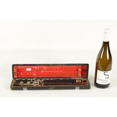 86 - A FINE CASED FRENCH FLUTE BY CLAIR GODFROY, A PARIS made in three sections with silver metal keys an... 