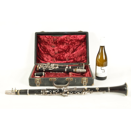 89 - A CASED PAIR OF BUFFET CRAMPON CLARINETS turned in ebony or grenadilla wood with impressed makers ma... 