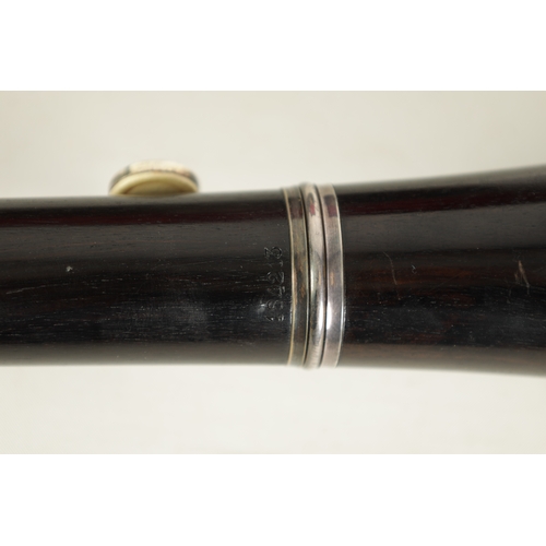 89 - A CASED PAIR OF BUFFET CRAMPON CLARINETS turned in ebony or grenadilla wood with impressed makers ma... 