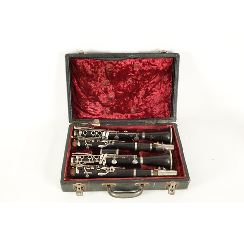 89 - A CASED PAIR OF BUFFET CRAMPON CLARINETS turned in ebony or grenadilla wood with impressed makers ma... 