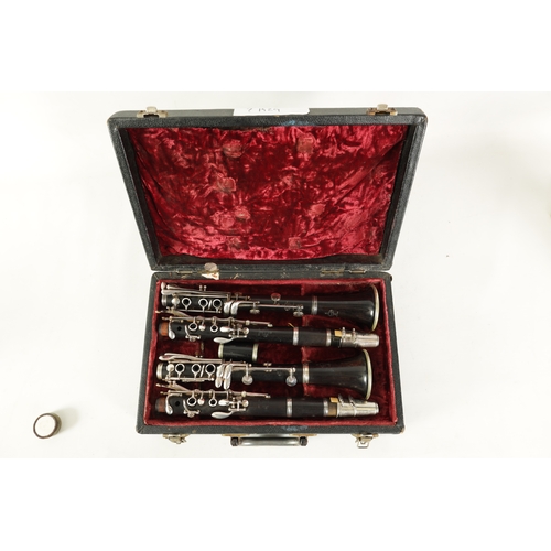 89 - A CASED PAIR OF BUFFET CRAMPON CLARINETS turned in ebony or grenadilla wood with impressed makers ma... 