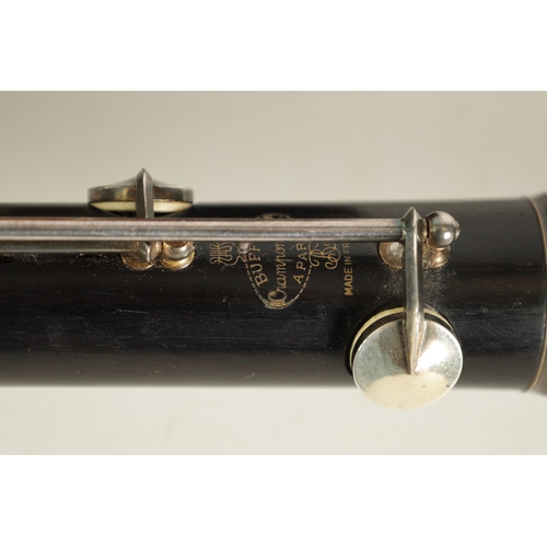 89 - A CASED PAIR OF BUFFET CRAMPON CLARINETS turned in ebony or grenadilla wood with impressed makers ma... 