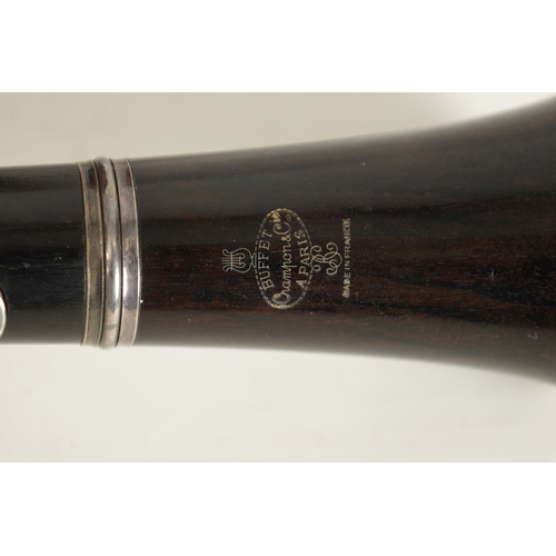 89 - A CASED PAIR OF BUFFET CRAMPON CLARINETS turned in ebony or grenadilla wood with impressed makers ma... 