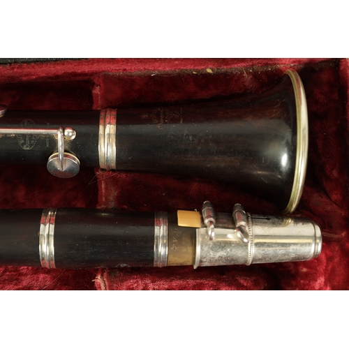 89 - A CASED PAIR OF BUFFET CRAMPON CLARINETS turned in ebony or grenadilla wood with impressed makers ma... 