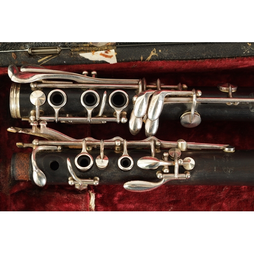 89 - A CASED PAIR OF BUFFET CRAMPON CLARINETS turned in ebony or grenadilla wood with impressed makers ma... 