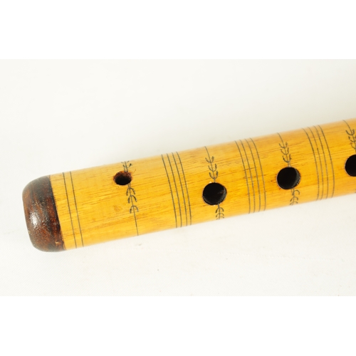 9 - A LATE 20TH CENTURY GREEK BAMBOO FLUTE having 8 finger holes, bands of engraved decoration, flowerhe... 