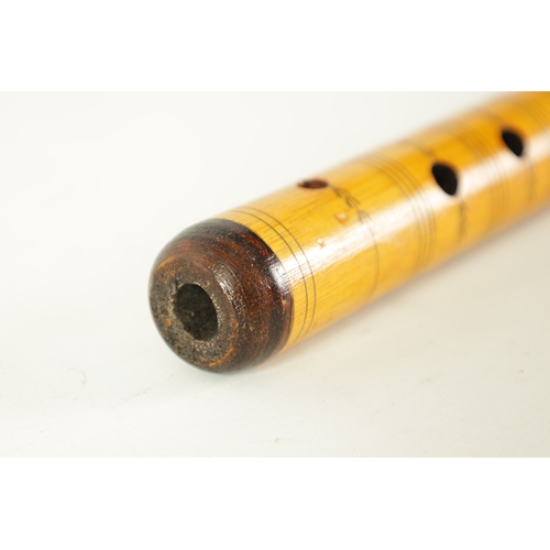 9 - A LATE 20TH CENTURY GREEK BAMBOO FLUTE having 8 finger holes, bands of engraved decoration, flowerhe... 